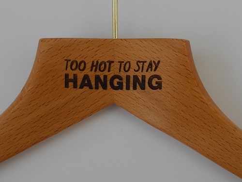 Laser Etching on Wooden Hangers 'Too Hot To Stay Hanging'